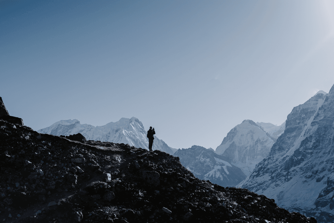 Silhouette of person on mountain